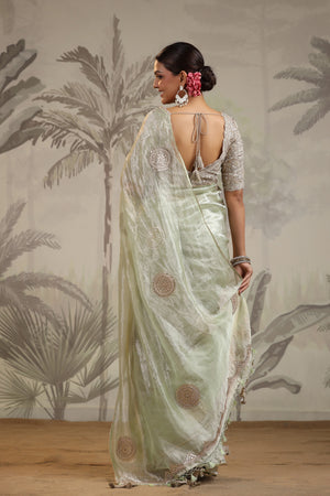 Shop pista green tissue silk sari online in USA with embroidered blouse. Make a fashion statement on festive occasions and weddings with designer suits, Indian dresses, Anarkali suits, palazzo suits, designer sarees, sharara suits, Bollywood saris from Pure Elegance Indian fashion store in USA.-back