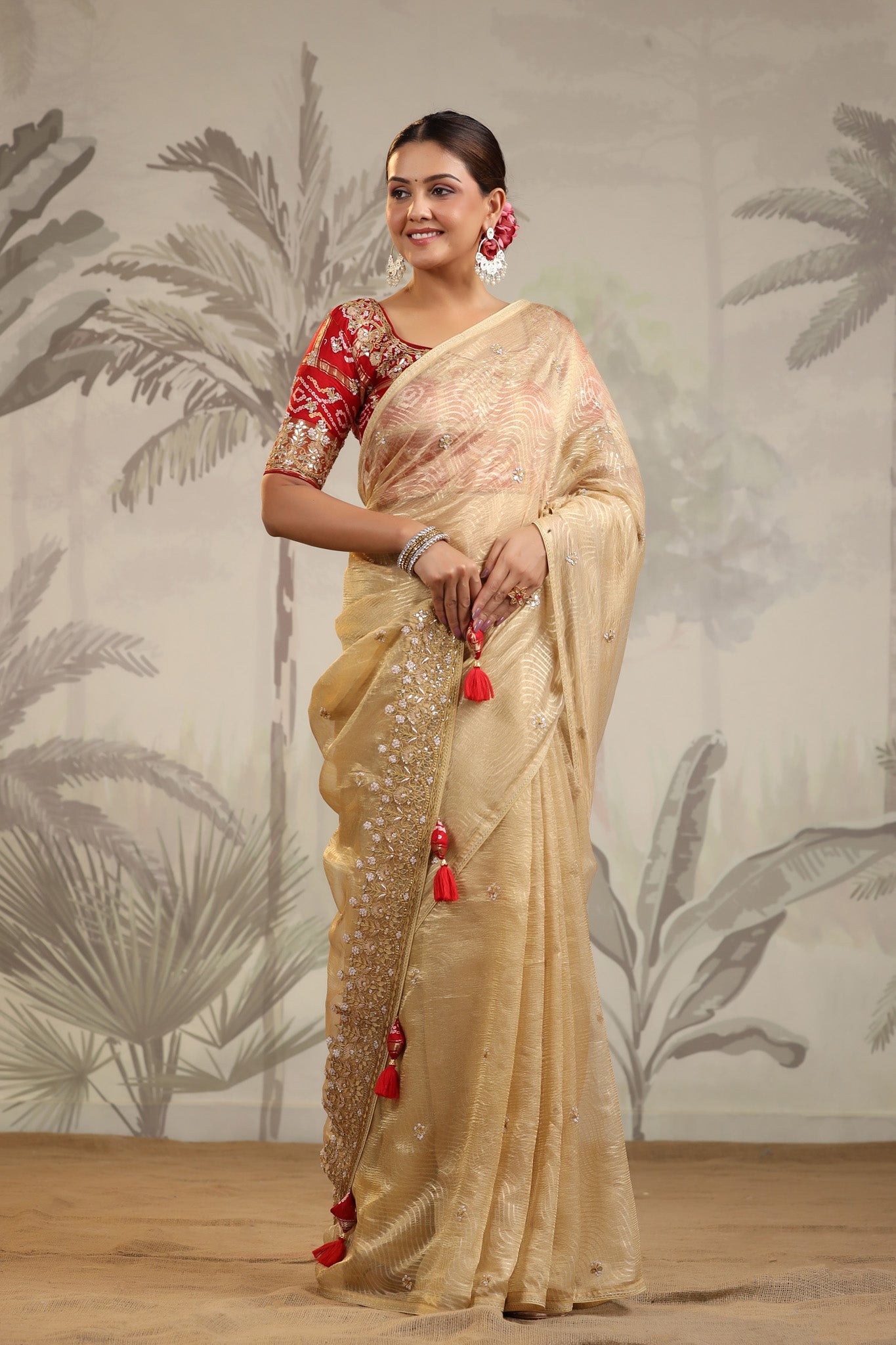 Shop golden tissue silk sari online in USA with red embroidered blouse. Make a fashion statement on festive occasions and weddings with designer suits, Indian dresses, Anarkali suits, palazzo suits, designer sarees, sharara suits, Bollywood saris from Pure Elegance Indian fashion store in USA.-saree