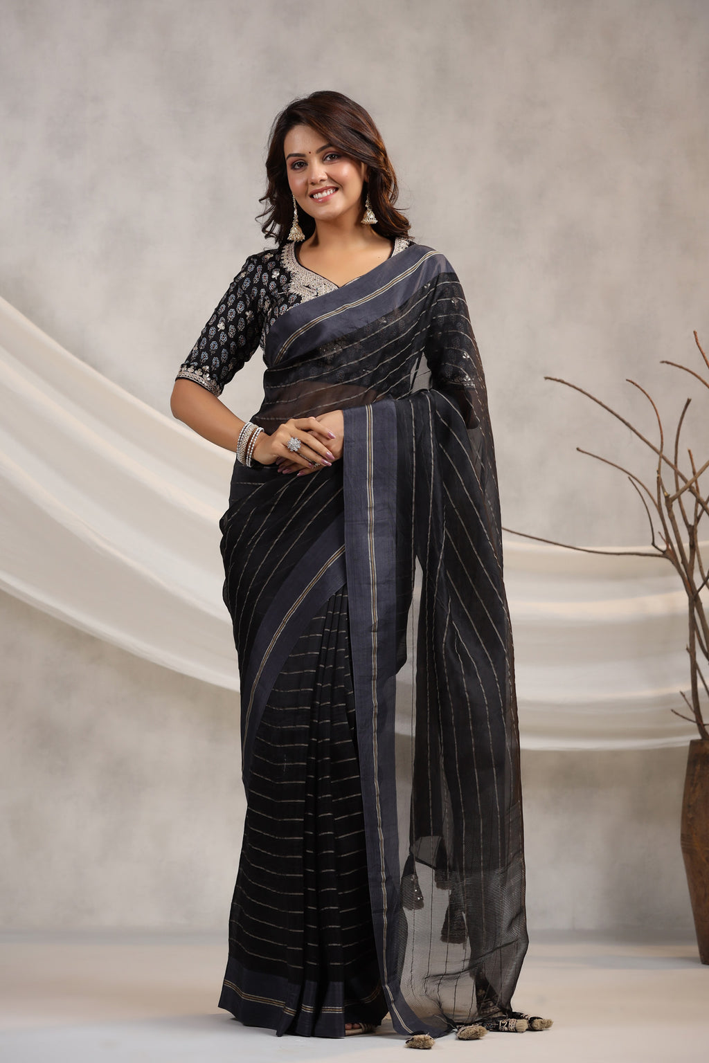 Shop black tissue organza sari online in USA with printed embroidered blouse. Make a fashion statement on festive occasions and weddings with designer suits, Indian dresses, Anarkali suits, palazzo suits, designer sarees, sharara suits, Bollywood saris from Pure Elegance Indian fashion store in USA.-full view
