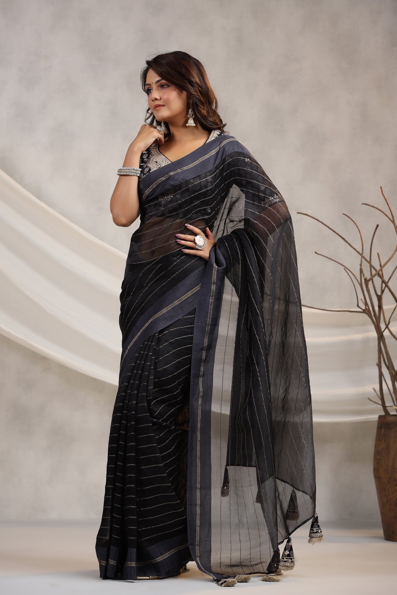 Shop black tissue organza sari online in USA with printed embroidered blouse. Make a fashion statement on festive occasions and weddings with designer suits, Indian dresses, Anarkali suits, palazzo suits, designer sarees, sharara suits, Bollywood saris from Pure Elegance Indian fashion store in USA.-saree