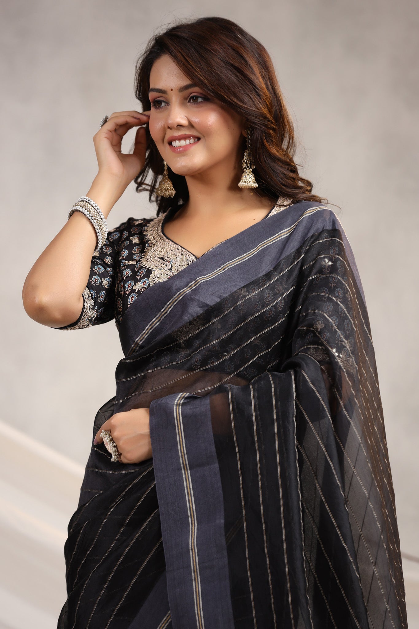 Shop black tissue organza sari online in USA with printed embroidered blouse. Make a fashion statement on festive occasions and weddings with designer suits, Indian dresses, Anarkali suits, palazzo suits, designer sarees, sharara suits, Bollywood saris from Pure Elegance Indian fashion store in USA.-closeup