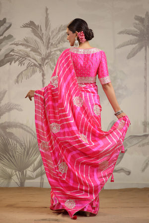 Buy stunning pink leheriya embroidered tussar silk sari online in USA with pink designer blouse. Make a fashion statement on festive occasions and weddings with designer suits, Indian dresses, Anarkali suits, palazzo suits, designer sarees, sharara suits, Bollywood saris from Pure Elegance Indian fashion store in USA.-back