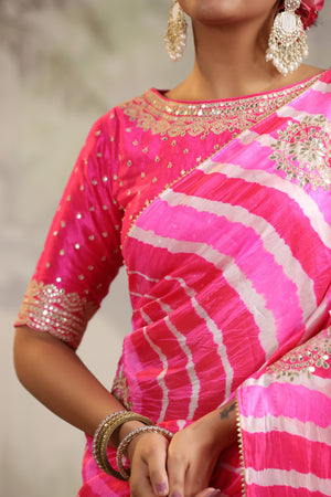 Buy stunning pink leheriya embroidered tussar silk sari online in USA with pink designer blouse. Make a fashion statement on festive occasions and weddings with designer suits, Indian dresses, Anarkali suits, palazzo suits, designer sarees, sharara suits, Bollywood saris from Pure Elegance Indian fashion store in USA.-closeup