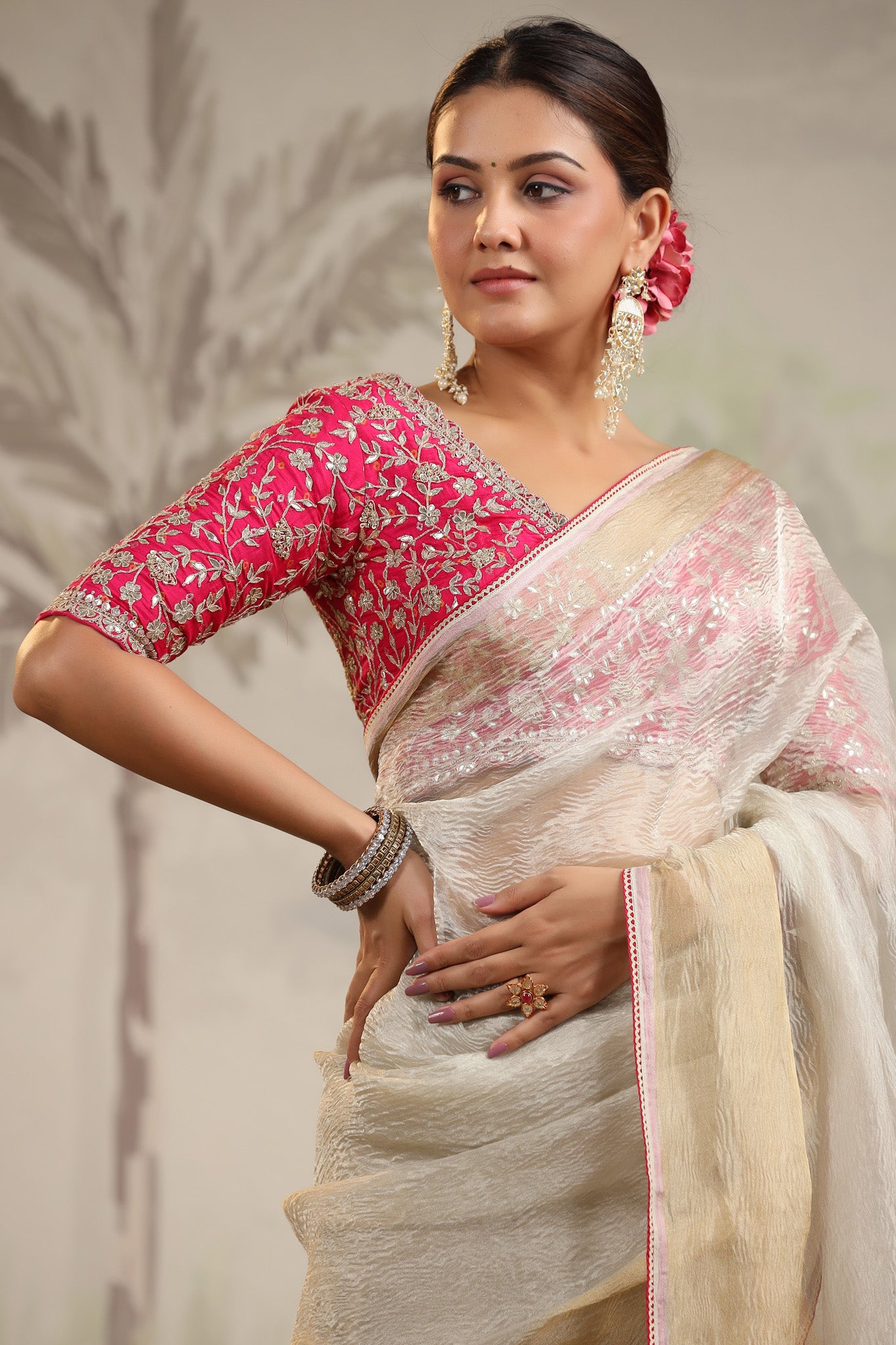 Buy beautiful cream tissue organza sari online in USA with pink embroidered designer blouse. Make a fashion statement on festive occasions and weddings with designer suits, Indian dresses, Anarkali suits, palazzo suits, designer sarees, sharara suits, Bollywood saris from Pure Elegance Indian fashion store in USA.-closeup