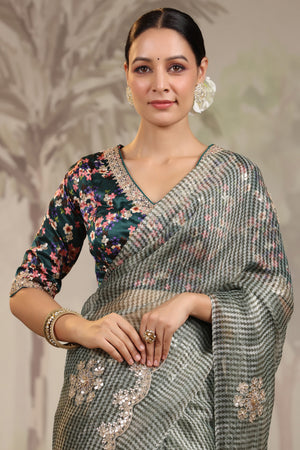 Shop beautiful light grey embroidered organza silk sari online in USA with designer blouse. Make a fashion statement on festive occasions and weddings with designer suits, Indian dresses, Anarkali suits, palazzo suits, designer sarees, sharara suits, Bollywood saris from Pure Elegance Indian fashion store in USA.-closeup