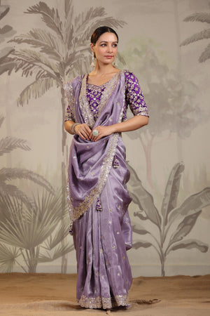 Shop lavender embroidered silk saree online in USA with embroidered designer blouse. Make a fashion statement on festive occasions and weddings with designer suits, Indian dresses, Anarkali suits, palazzo suits, designer sarees, sharara suits, Bollywood saris from Pure Elegance Indian fashion store in USA.-front