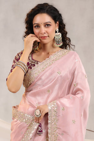 Shop powder pink embroidered silk saree online in USA with embroidered designer blouse. Make a fashion statement on festive occasions and weddings with designer suits, Indian dresses, Anarkali suits, palazzo suits, designer sarees, sharara suits, Bollywood saris from Pure Elegance Indian fashion store in USA.-closeup