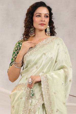 Shop beautiful pista green embroidered silk saree online in USA with embroidered designer blouse. Make a fashion statement on festive occasions and weddings with designer suits, Indian dresses, Anarkali suits, palazzo suits, designer sarees, sharara suits, Bollywood saris from Pure Elegance Indian fashion store in USA.-closeup