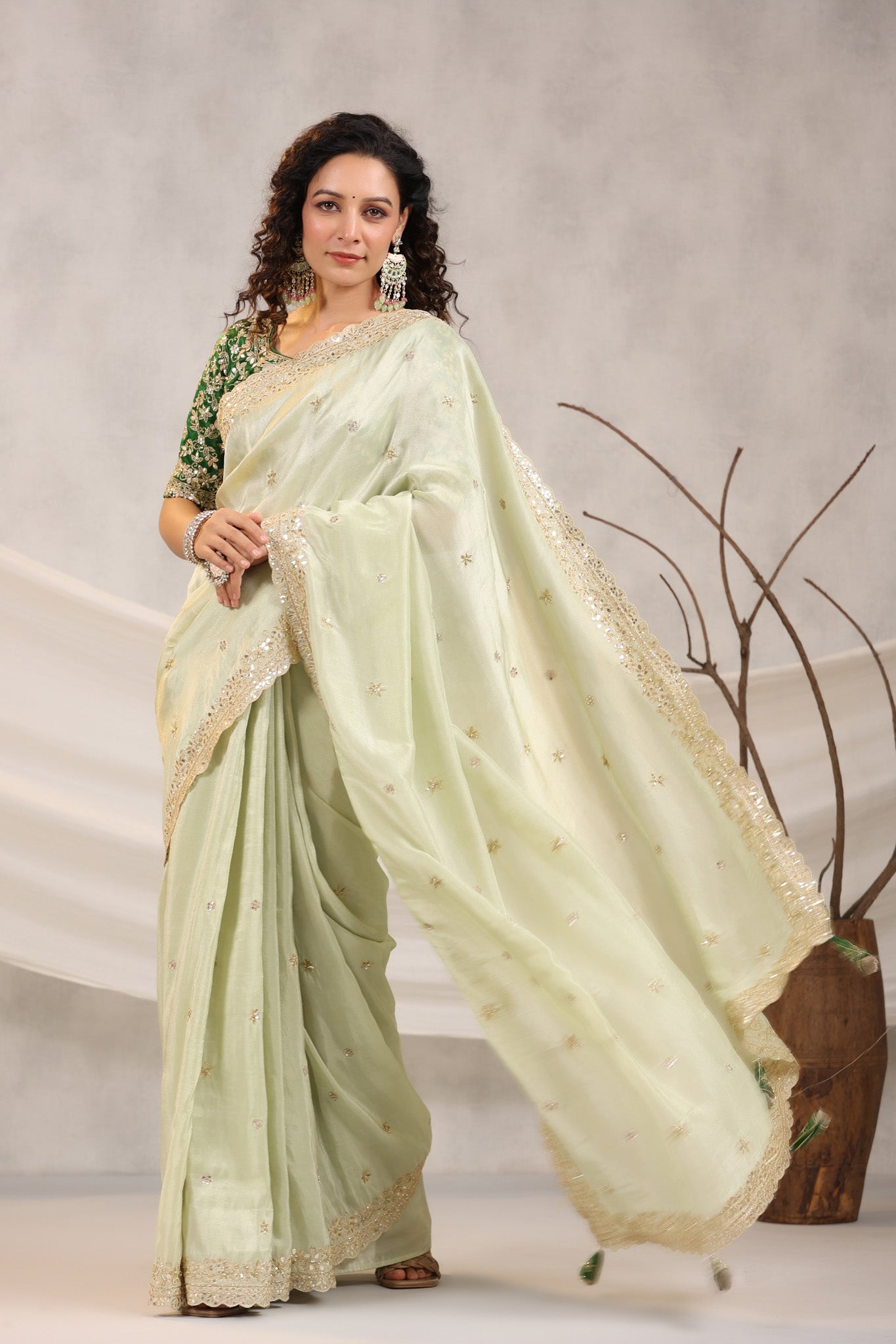 Shop beautiful pista green embroidered silk saree online in USA with embroidered designer blouse. Make a fashion statement on festive occasions and weddings with designer suits, Indian dresses, Anarkali suits, palazzo suits, designer sarees, sharara suits, Bollywood saris from Pure Elegance Indian fashion store in USA.-pallu