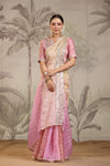 Shop stunning peach and pink embroidered tissue silk saree online in USA with embroidered blouse. Make a fashion statement on festive occasions and weddings with designer suits, Indian dresses, Anarkali suits, palazzo suits, designer sarees, sharara suits, Bollywood saris from Pure Elegance Indian fashion store in USA.-full view