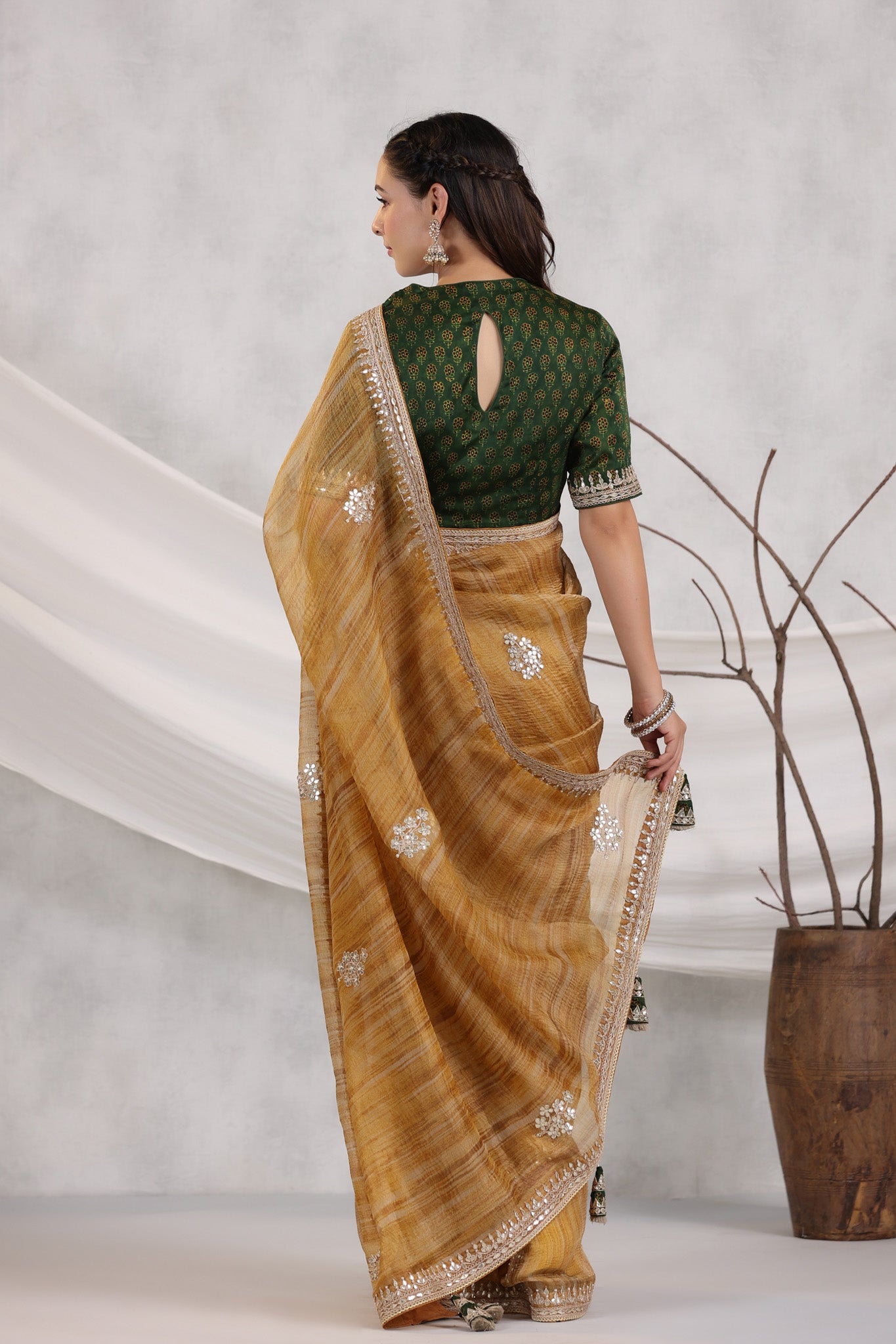Shop beautiful mustard striped organza saree online in USA with green embroidered blouse. Make a fashion statement on festive occasions and weddings with designer suits, Indian dresses, Anarkali suits, palazzo suits, designer sarees, sharara suits, Bollywood saris from Pure Elegance Indian fashion store in USA.-back