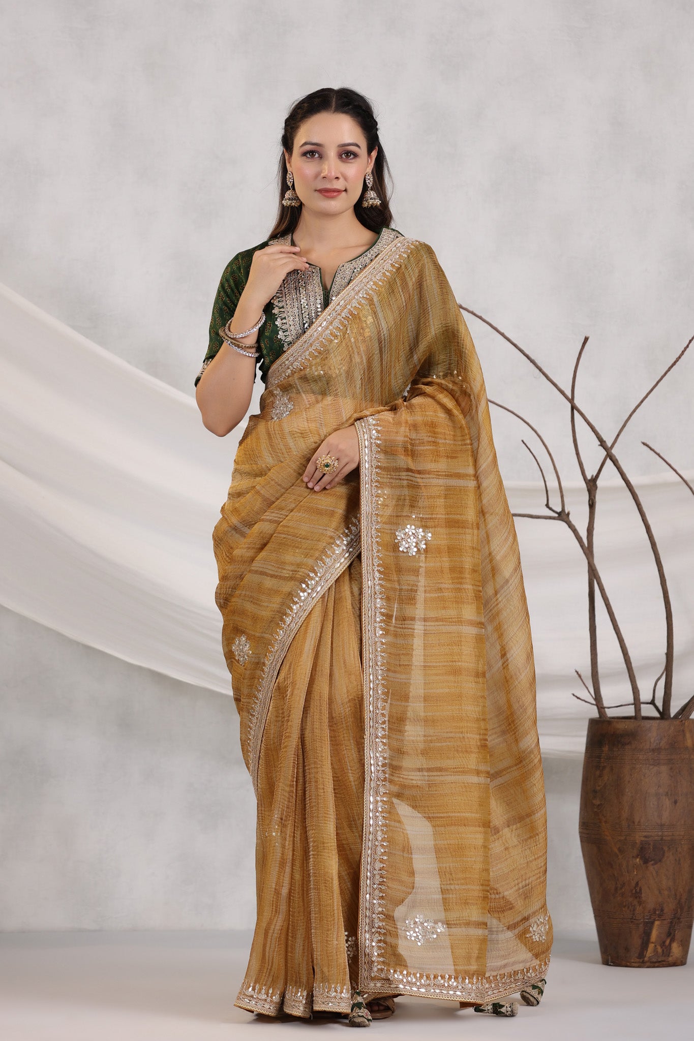 Shop beautiful mustard striped organza saree online in USA with green embroidered blouse. Make a fashion statement on festive occasions and weddings with designer suits, Indian dresses, Anarkali suits, palazzo suits, designer sarees, sharara suits, Bollywood saris from Pure Elegance Indian fashion store in USA.-full view
