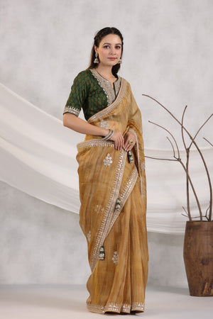 Shop beautiful mustard striped organza saree online in USA with green embroidered blouse. Make a fashion statement on festive occasions and weddings with designer suits, Indian dresses, Anarkali suits, palazzo suits, designer sarees, sharara suits, Bollywood saris from Pure Elegance Indian fashion store in USA.-side