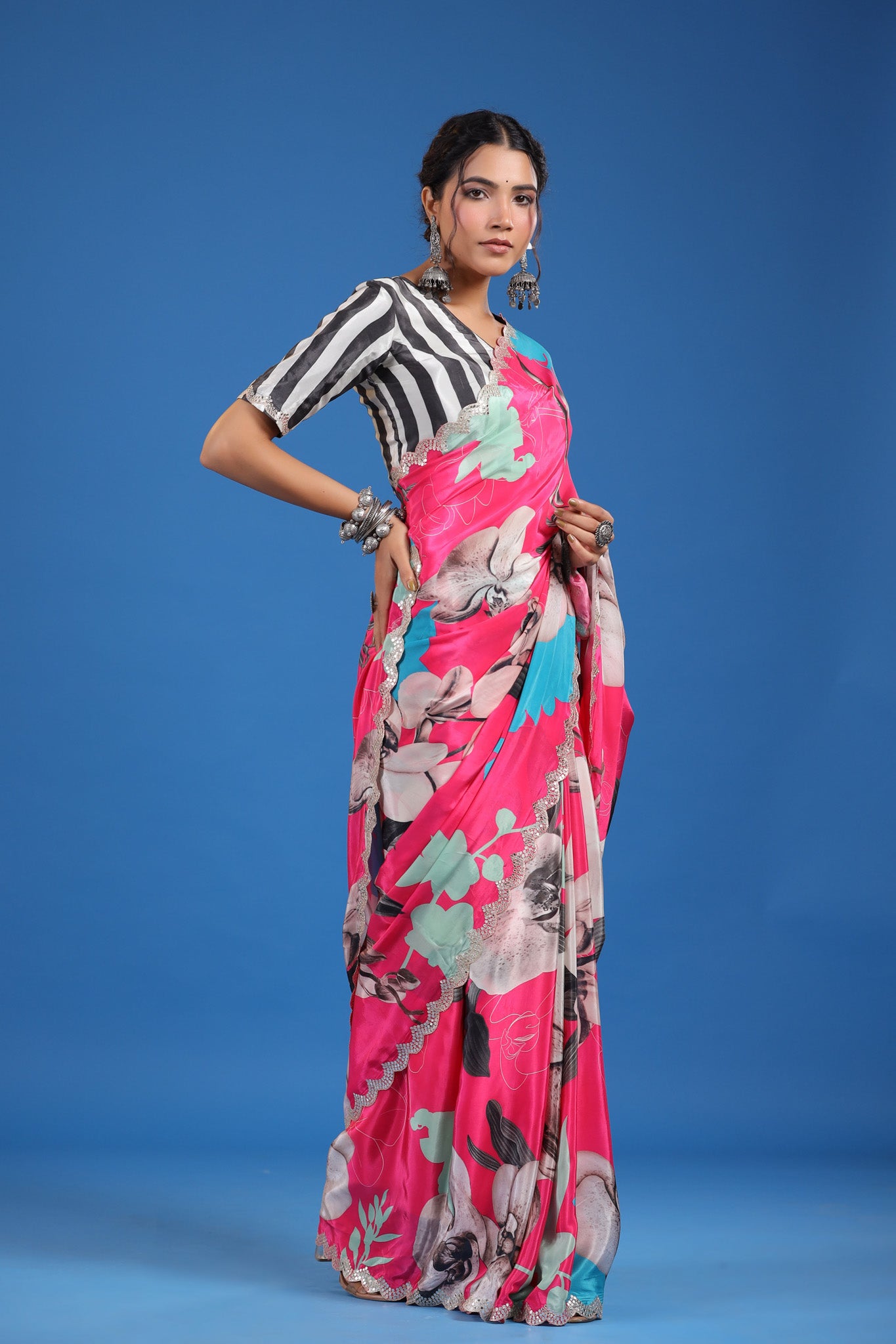 Shop pink floral crepe georgette sari online in USA with saree blouse. Look classy at weddings and special occasions in exquisite designer sarees, embroidered sarees, party sarees, handwoven saris, pure silk sarees, Banarasi sarees, Kanjivaram sarees from Pure Elegance Indian saree store in USA.-side