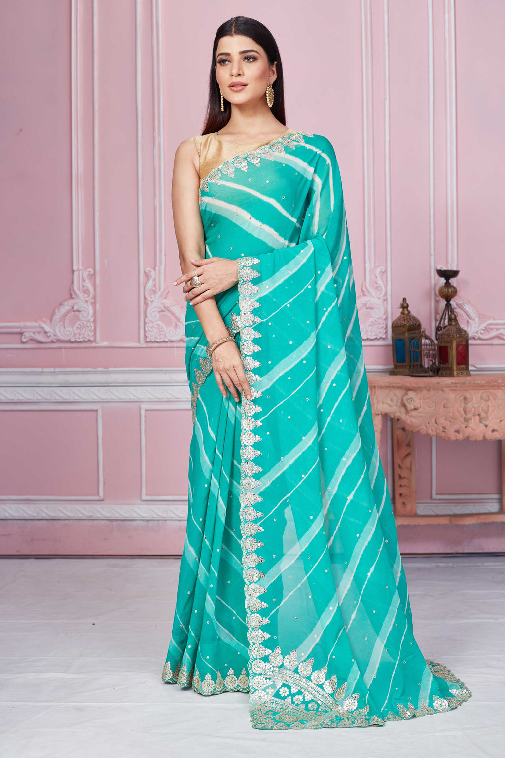 Shop sea green georgette saree online in USA with embroidered scalloped border. Look your best on festive occasions in latest designer sarees, pure silk sarees, Kanjivaram silk saris, handwoven saris, tussar silk saris, embroidered saris from Pure Elegance Indian clothing store in USA.-full view