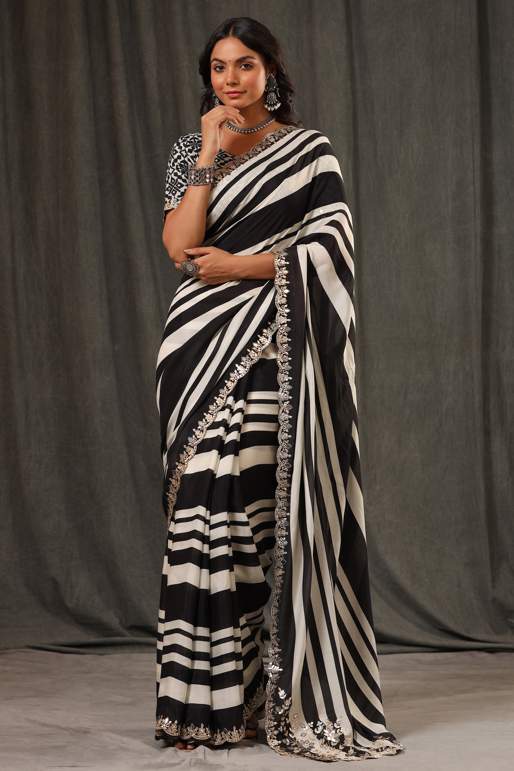 Shop black and white stripes crepe georgette saree online in USA with saree blouse. Look classy at weddings and special occasions in exquisite designer sarees, embroidered sarees, party sarees, handwoven saris, pure silk sarees, Banarasi sarees, Kanjivaram sarees from Pure Elegance Indian saree store in USA.-full view