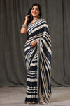 Buy stunning black and white stripes crepe georgette sari online in USA with saree blouse. Look classy at weddings and special occasions in exquisite designer sarees, embroidered sarees, party sarees, handwoven saris, pure silk sarees, Banarasi sarees, Kanjivaram sarees from Pure Elegance Indian saree store in USA.-full view