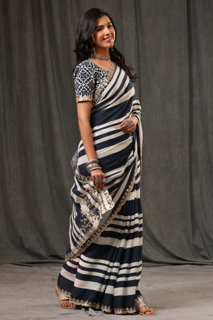 Buy stunning black and white stripes crepe georgette sari online in USA with saree blouse. Look classy at weddings and special occasions in exquisite designer sarees, embroidered sarees, party sarees, handwoven saris, pure silk sarees, Banarasi sarees, Kanjivaram sarees from Pure Elegance Indian saree store in USA.-side