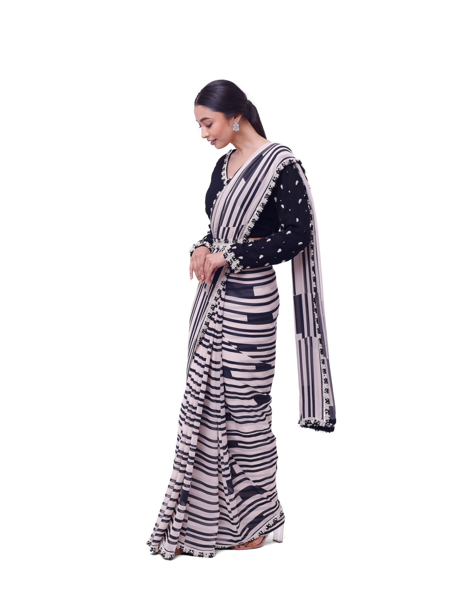 Buy white and black stripes georgette saree online in USA with black blouse. Look like a royalty in exquisite designer sarees, embroidered sarees, handwoven sarees, pure silk saris, Banarasi sarees, Kanjivaram sarees from Pure Elegance Indian saree store in USA.-side