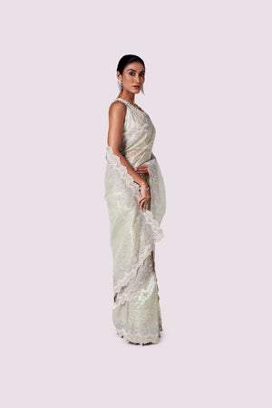 Shop mint green embroidered organza saree online in USA with designer blouse. Look like a royalty in exquisite designer sarees, embroidered sarees, handwoven sarees, pure silk saris, Banarasi sarees, Kanjivaram sarees from Pure Elegance Indian saree store in USA.-side