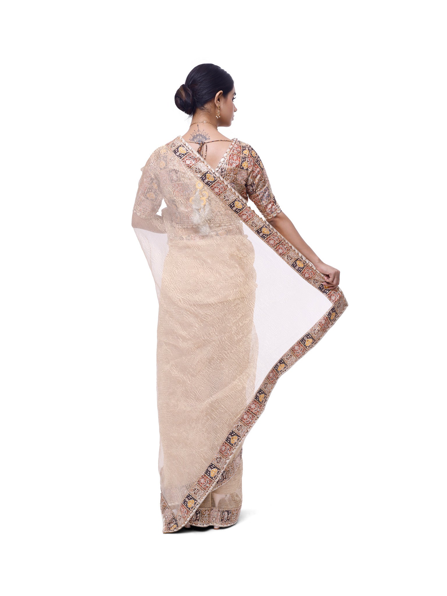 Shop champagne embroidered organza saree online in USA with designer blouse. Look like a royalty in exquisite designer sarees, embroidered sarees, handwoven sarees, pure silk saris, Banarasi sarees, Kanjivaram sarees from Pure Elegance Indian saree store in USA.-back