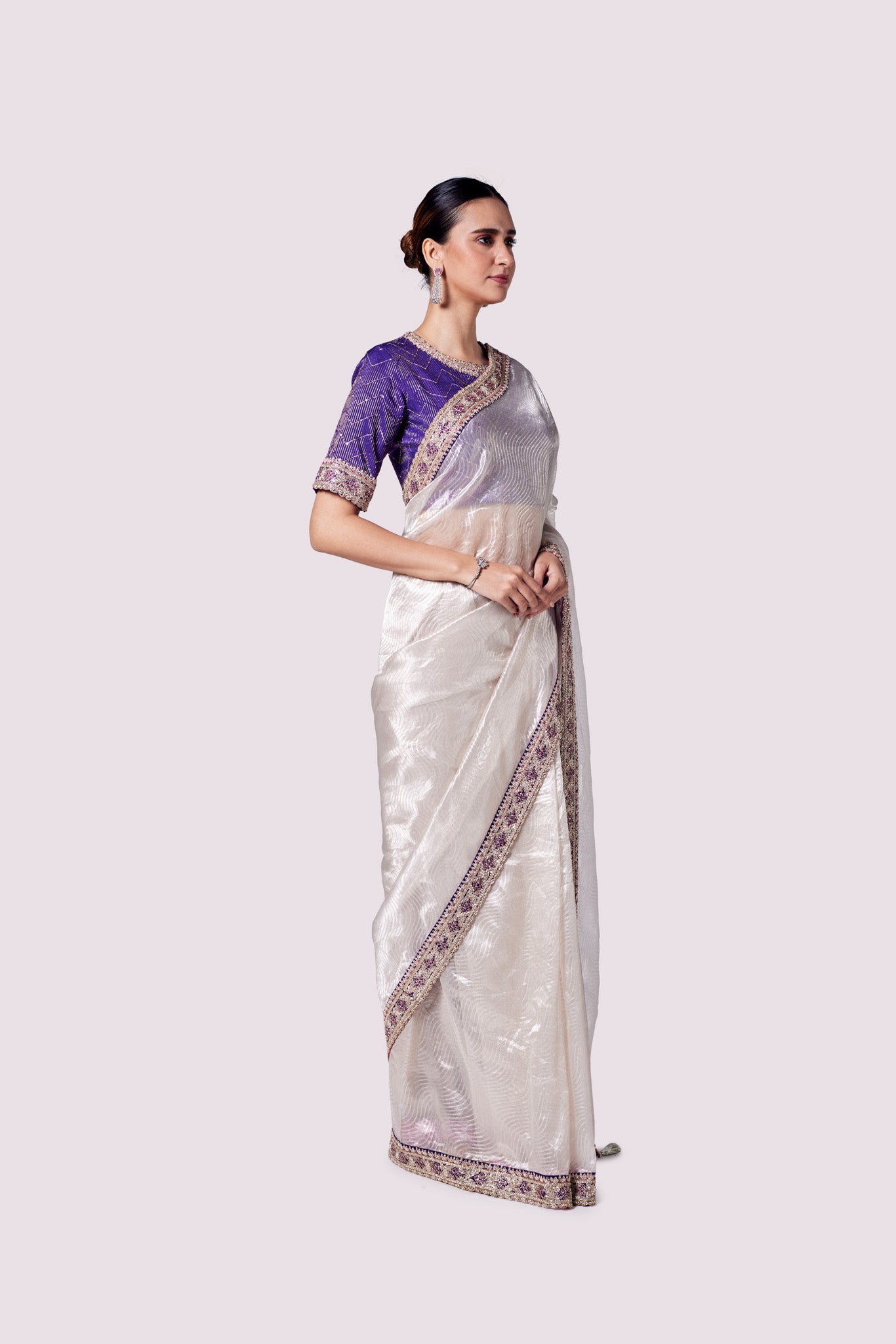 Buy silver zari tissue saree online in USA with purple embroidered designer blouse. Look like a royalty in exquisite designer sarees, embroidered sarees, handwoven sarees, pure silk saris, Banarasi sarees, Kanjivaram sarees from Pure Elegance Indian saree store in USA.-blouse