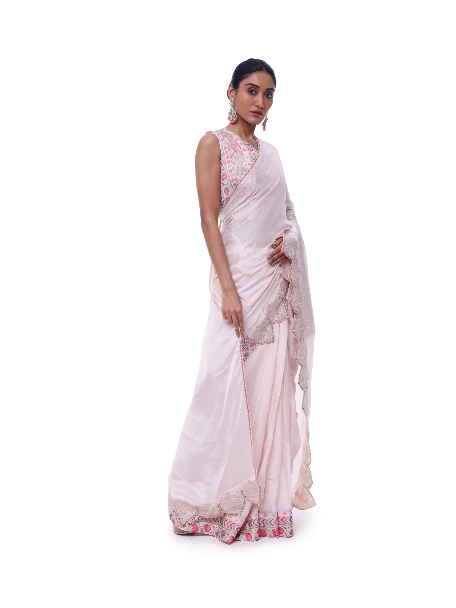 Buy powder pink chiffon saree online in USA with scalloped border and embroidered blouse. Look like a royalty in exquisite designer sarees, embroidered sarees, handwoven sarees, pure silk saris, Banarasi sarees, Kanjivaram sarees from Pure Elegance Indian saree store in USA.-side