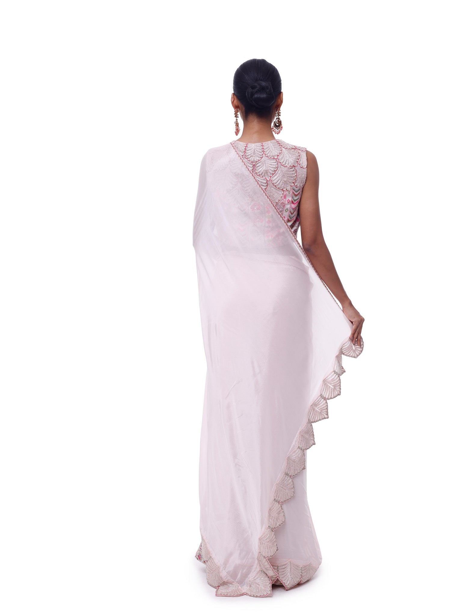 Buy powder pink chiffon saree online in USA with scalloped border and embroidered blouse. Look like a royalty in exquisite designer sarees, embroidered sarees, handwoven sarees, pure silk saris, Banarasi sarees, Kanjivaram sarees from Pure Elegance Indian saree store in USA.-back
