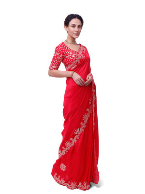 Shop red embroidered silk saree online in USA with embroidered designer blouse. Look like a royalty in exquisite designer sarees, embroidered sarees, handwoven sarees, pure silk saris, Banarasi sarees, Kanjivaram sarees from Pure Elegance Indian saree store in USA.-side