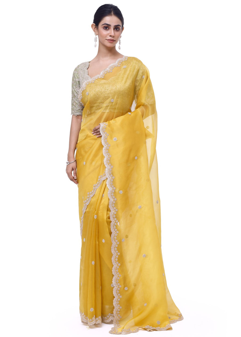 Buy yellow embroidered organza saree online in USA with green embroidered blouse. Look like a royalty in exquisite designer sarees, embroidered sarees, handwoven sarees, pure silk saris, Banarasi sarees, Kanjivaram sarees from Pure Elegance Indian saree store in USA.-full view