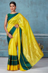Buy yellow Pattu silk saree online in USA with green Mashru border. Look your best on festive occasions in latest designer saris, pure silk saris, Kanchipuram silk sarees, handwoven sarees, tussar silk sarees, embroidered sarees from Pure Elegance Indian fashion store in USA.-full view