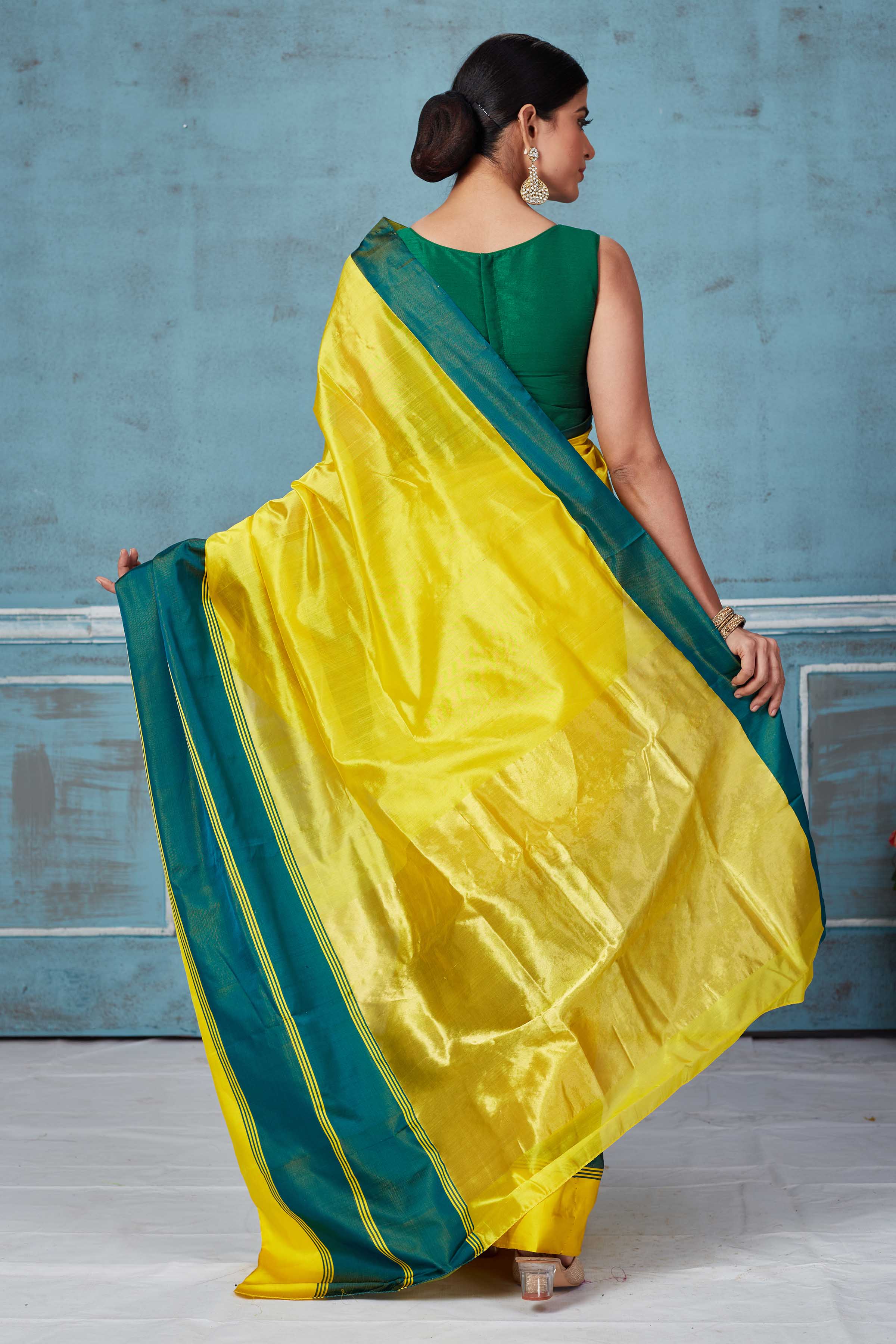 Buy yellow Pattu silk saree online in USA with green Mashru border. Look your best on festive occasions in latest designer saris, pure silk saris, Kanchipuram silk sarees, handwoven sarees, tussar silk sarees, embroidered sarees from Pure Elegance Indian fashion store in USA.-back