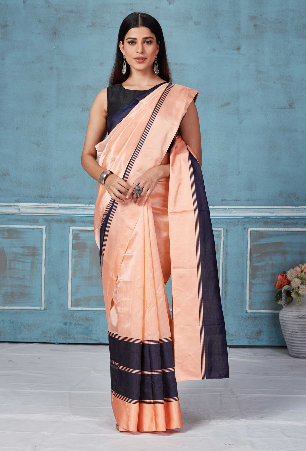 Shop peach Pattu silk saree online in USA with black Mashru border. Look your best on festive occasions in latest designer saris, pure silk saris, Kanchipuram silk sarees, handwoven sarees, tussar silk sarees, embroidered sarees from Pure Elegance Indian fashion store in USA.-full view