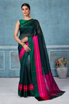 Buy dark green Pattu silk saree online in USA with pink Mashru border. Look your best on festive occasions in latest designer saris, pure silk saris, Kanchipuram silk sarees, handwoven sarees, tussar silk sarees, embroidered sarees from Pure Elegance Indian fashion store in USA.-full view