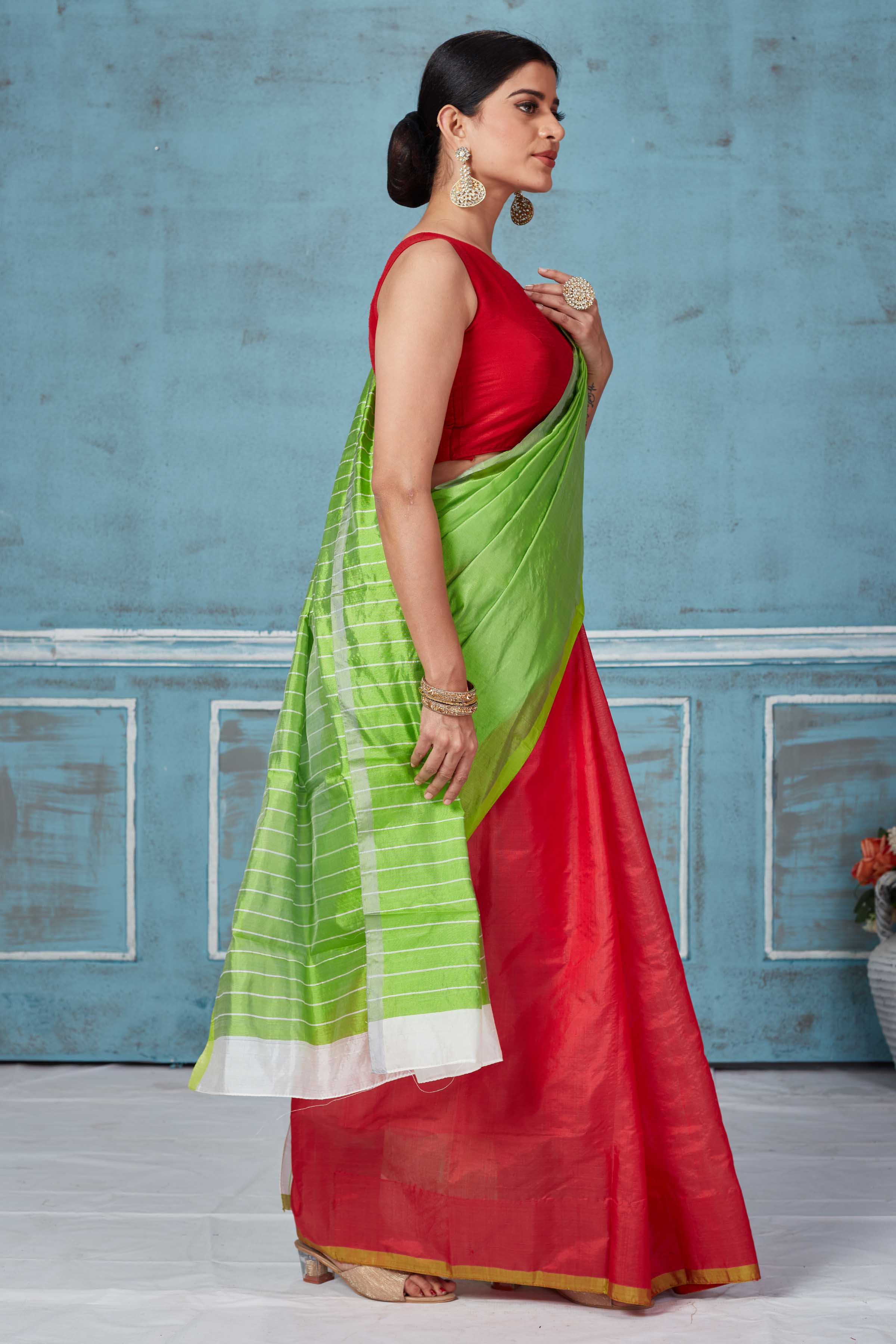 Buy green and red half and half Pattu silk saree online in USA. Look your best on festive occasions in latest designer saris, pure silk saris, Kanchipuram silk sarees, handwoven sarees, tussar silk sarees, embroidered sarees from Pure Elegance Indian fashion store in USA.-side