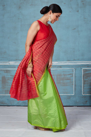 Buy red striped and green half and half Pattu silk saree online in USA. Look your best on festive occasions in latest designer saris, pure silk saris, Kanchipuram silk sarees, handwoven sarees, tussar silk sarees, embroidered sarees from Pure Elegance Indian fashion store in USA.-side