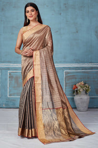 Shop beige striped Pattu silk saree online in USA with zari border. Look your best on festive occasions in latest designer saris, pure silk saris, Kanchipuram silk sarees, handwoven sarees, tussar silk sarees, embroidered sarees from Pure Elegance Indian fashion store in USA.-full view