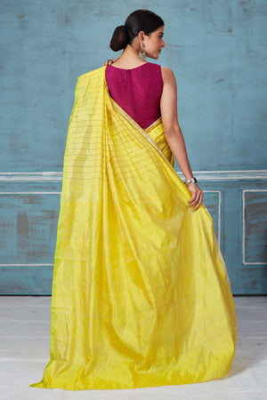 Buy yellow striped and purple half and half Pattu silk saree online in USA. Look your best on festive occasions in latest designer saris, pure silk saris, Kanchipuram silk sarees, handwoven sarees, tussar silk sarees, embroidered sarees from Pure Elegance Indian fashion store in USA.-back