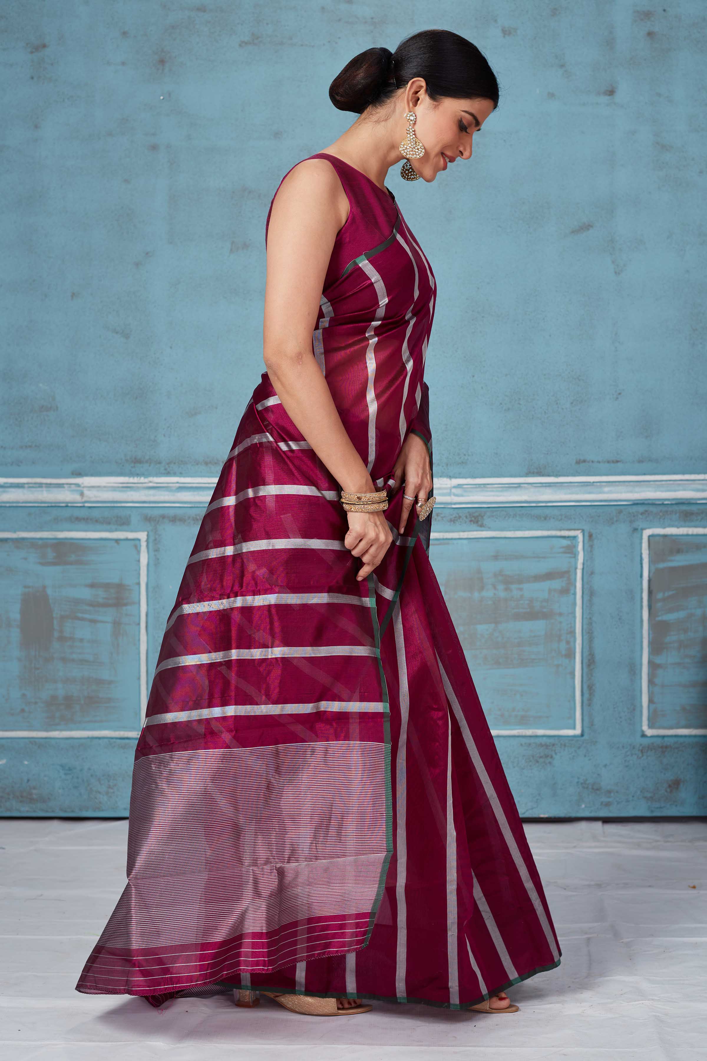 Shop wine and white stripes Pattu silk saree online in USA. Look your best on festive occasions in latest designer saris, pure silk saris, Kanchipuram silk sarees, handwoven sarees, tussar silk sarees, embroidered sarees from Pure Elegance Indian fashion store in USA.-side
