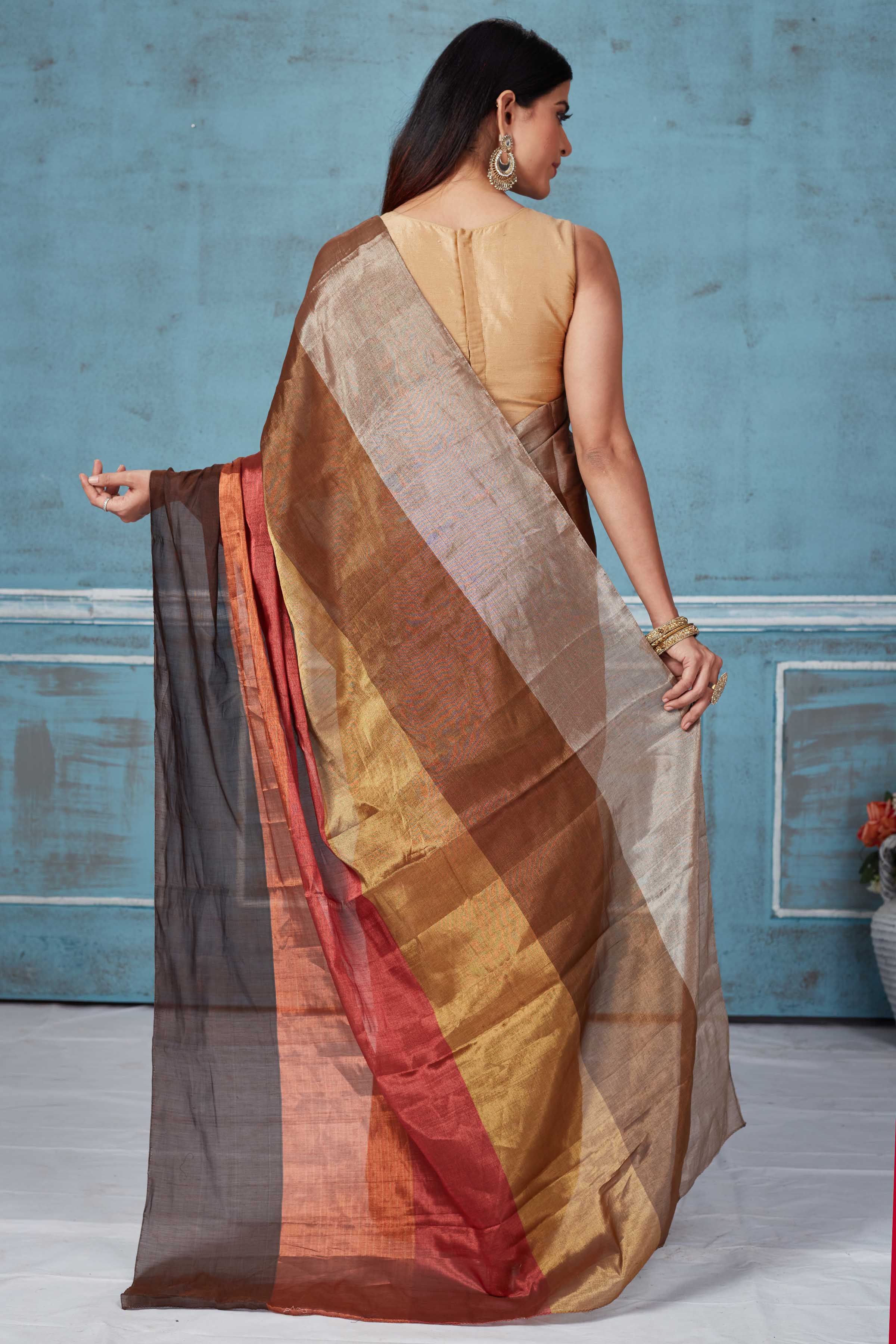 Buy beautiful earthy tones tissue silk golden zari sari online in USA. Look your best on festive occasions in latest designer saris, pure silk saris, Kanchipuram silk sarees, handwoven sarees, tussar silk sarees, embroidered sarees from Pure Elegance Indian fashion store in USA.-back