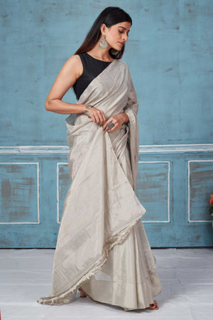 Shop stunning silver tissue silk zari sari online in USA. Look your best on festive occasions in latest designer saris, pure silk saris, Kanchipuram silk sarees, handwoven sarees, tussar silk sarees, embroidered sarees from Pure Elegance Indian fashion store in USA.-side