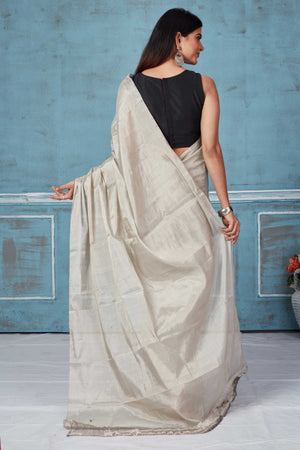 Shop stunning silver tissue silk zari sari online in USA. Look your best on festive occasions in latest designer saris, pure silk saris, Kanchipuram silk sarees, handwoven sarees, tussar silk sarees, embroidered sarees from Pure Elegance Indian fashion store in USA.-back