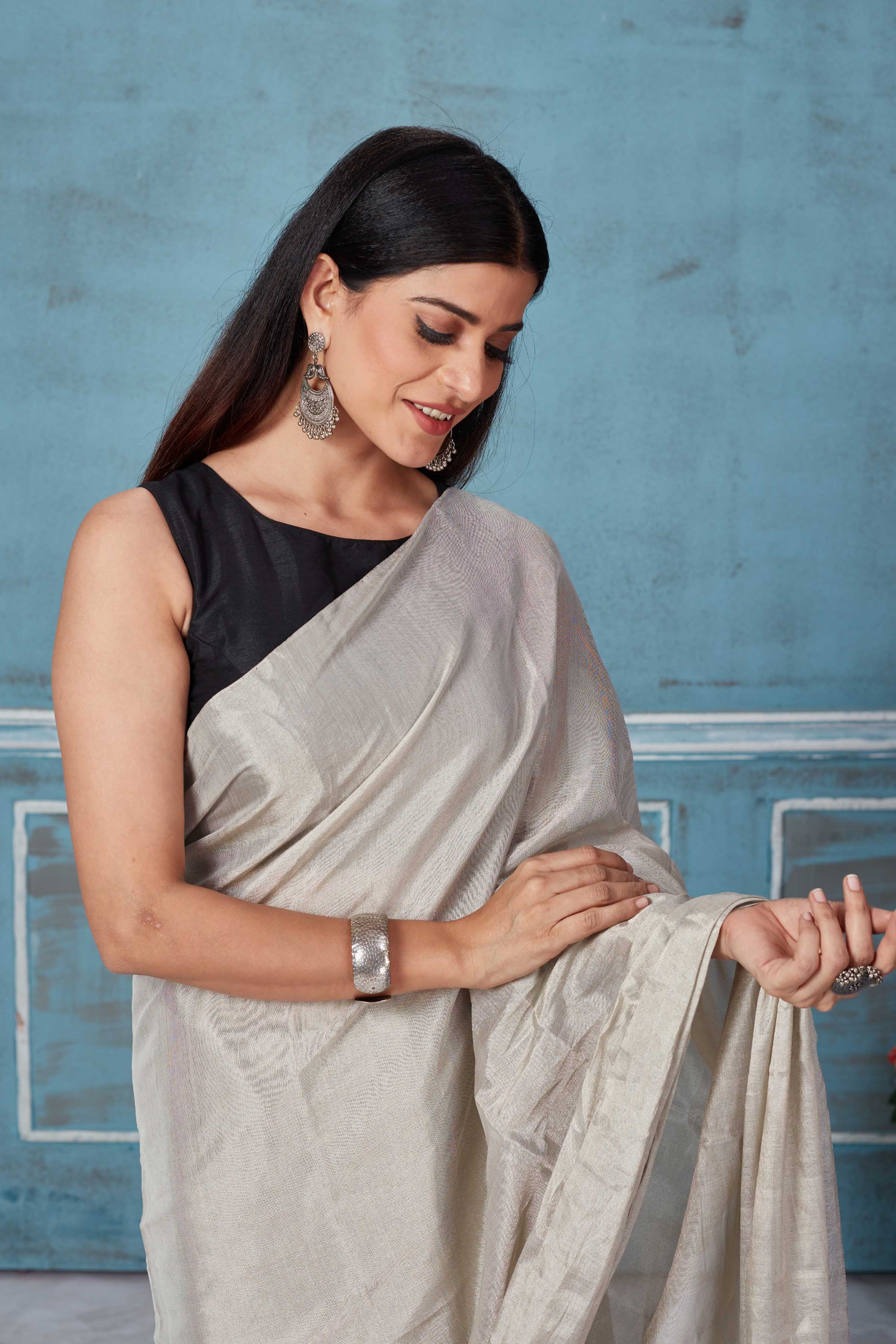 Shop stunning silver tissue silk zari sari online in USA. Look your best on festive occasions in latest designer saris, pure silk saris, Kanchipuram silk sarees, handwoven sarees, tussar silk sarees, embroidered sarees from Pure Elegance Indian fashion store in USA.-closeup