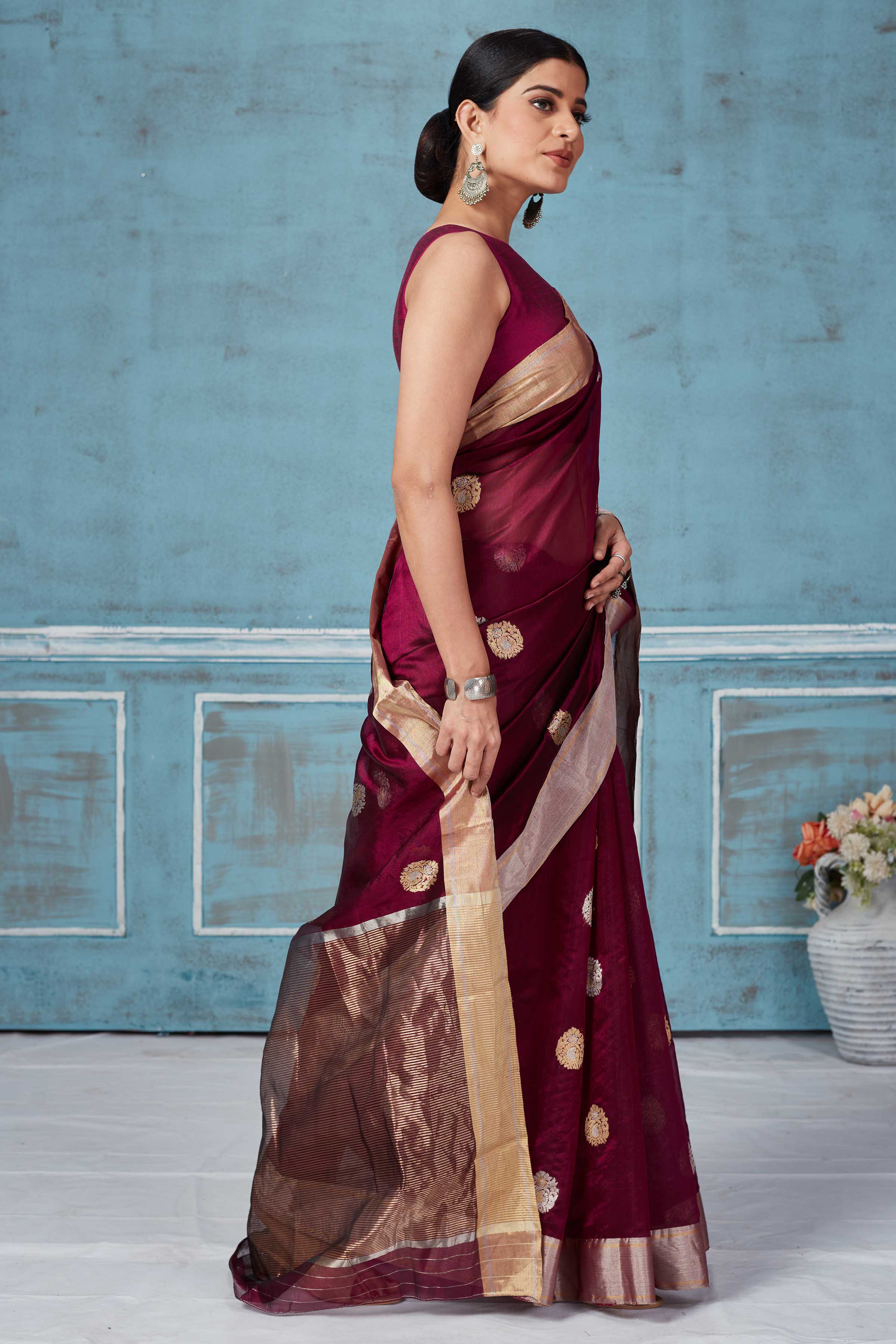 Buy wine color Pattu silk sari online in USA with silver zari motifs. Look your best on festive occasions in latest designer saris, pure silk saris, Kanchipuram silk sarees, handwoven sarees, tussar silk sarees, embroidered sarees from Pure Elegance Indian fashion store in USA.-side