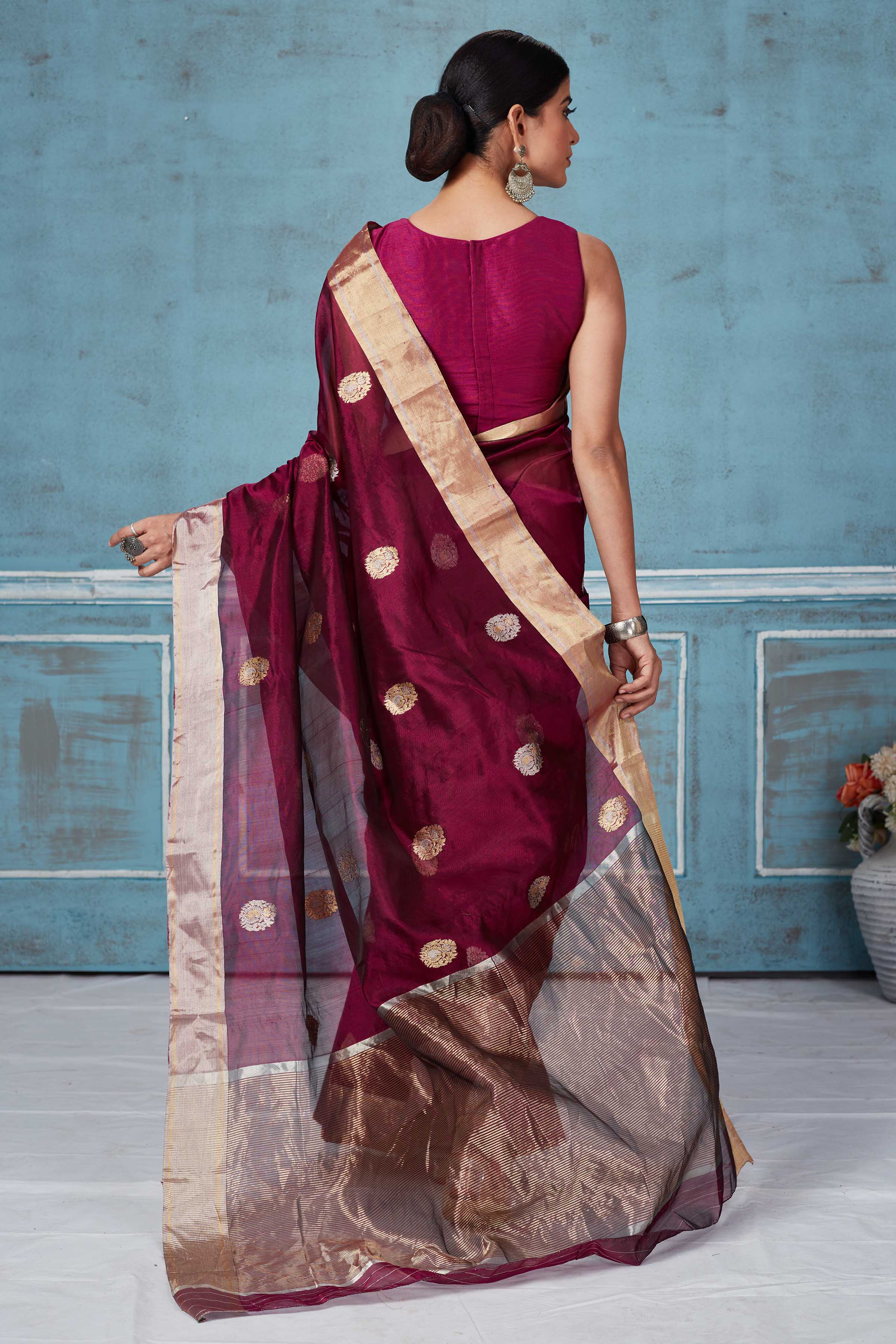Buy wine color Pattu silk sari online in USA with silver zari motifs. Look your best on festive occasions in latest designer saris, pure silk saris, Kanchipuram silk sarees, handwoven sarees, tussar silk sarees, embroidered sarees from Pure Elegance Indian fashion store in USA.-back