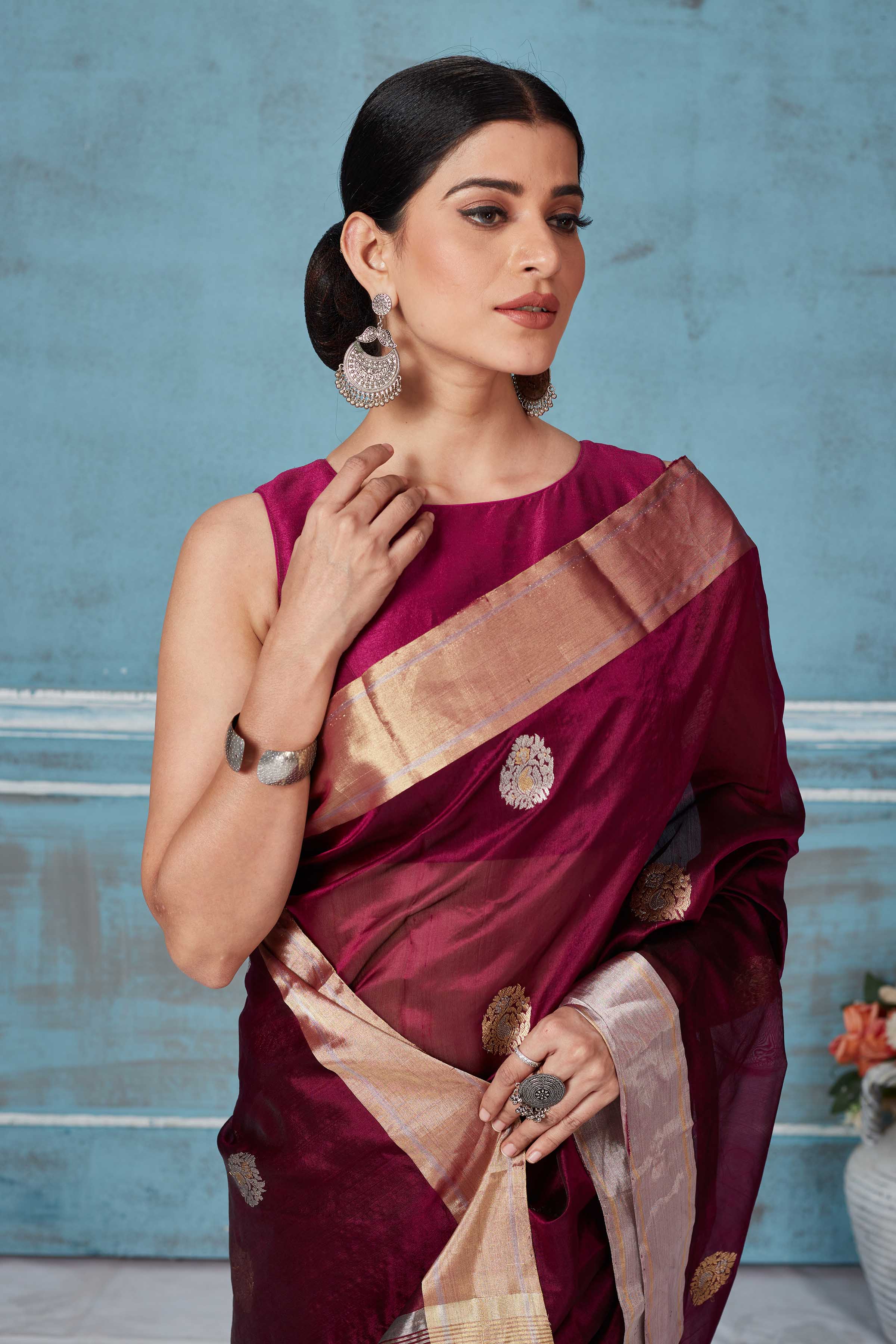Buy wine color Pattu silk sari online in USA with silver zari motifs. Look your best on festive occasions in latest designer saris, pure silk saris, Kanchipuram silk sarees, handwoven sarees, tussar silk sarees, embroidered sarees from Pure Elegance Indian fashion store in USA.-closeup