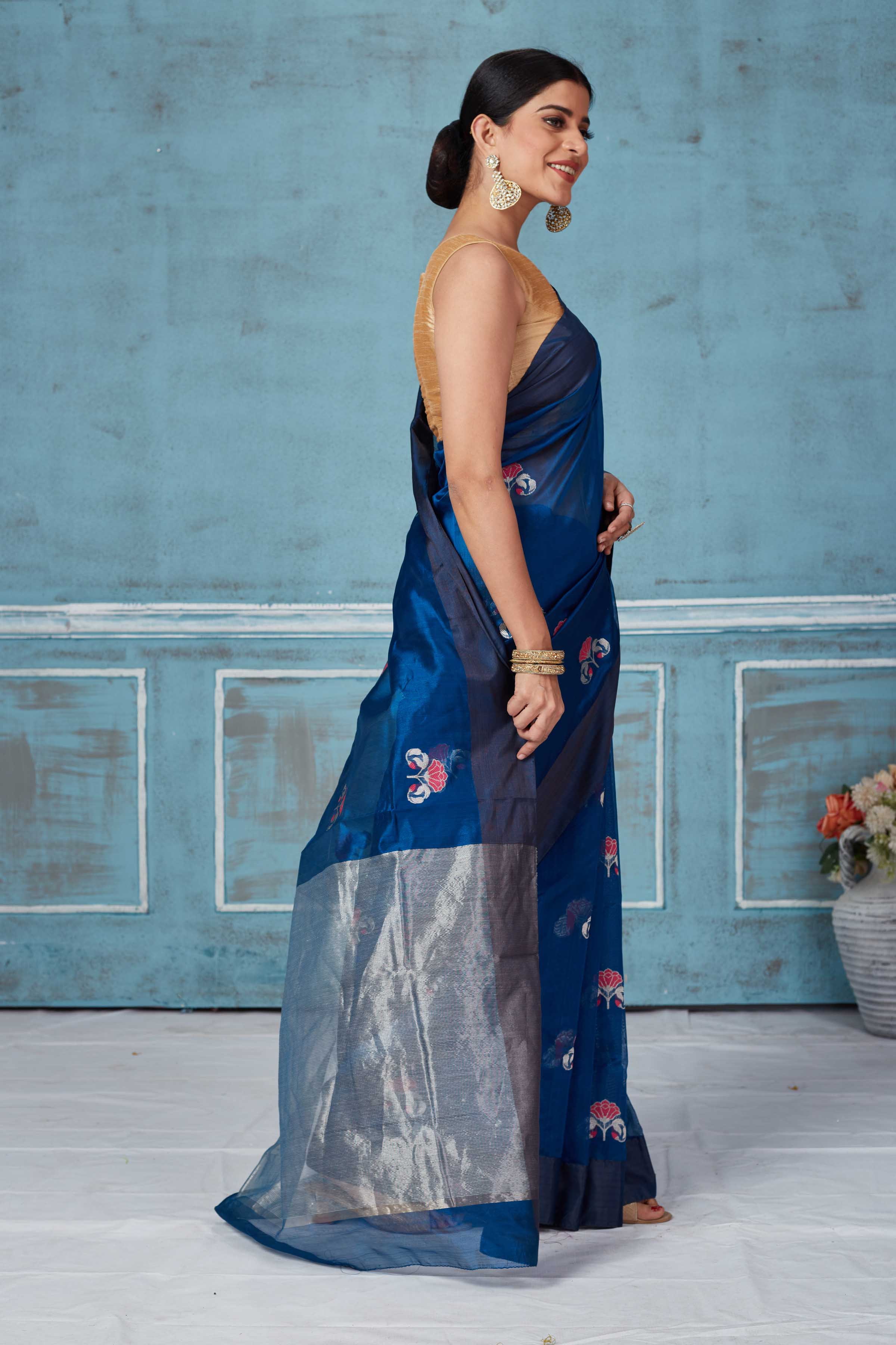 Shop blue Pattu silk sari online in USA with floral zari motifs. Look your best on festive occasions in latest designer saris, pure silk saris, Kanchipuram silk sarees, handwoven sarees, tussar silk sarees, embroidered sarees from Pure Elegance Indian fashion store in USA.-side
