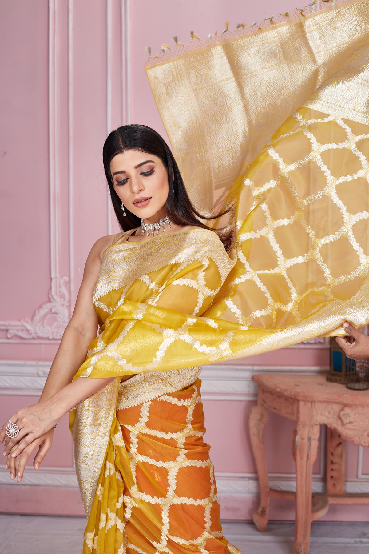 Shop beautiful yellow and orange Banarasi saree online in USA with zari jaal. Look your best on festive occasions in latest designer saris, pure silk sarees, Kanjivaram silk sarees, handwoven saris, tussar silk sarees, embroidered saris from Pure Elegance Indian fashion store in USA.-closeup