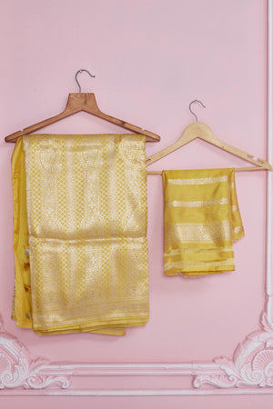 Buy light yellow Banarasi saree online in USA with minakari floral border. Look your best on festive occasions in latest designer saris, pure silk sarees, Kanjivaram silk sarees, handwoven saris, tussar silk sarees, embroidered saris from Pure Elegance Indian fashion store in USA.-blouse