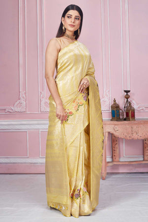 Buy light yellow Banarasi saree online in USA with minakari floral border. Look your best on festive occasions in latest designer saris, pure silk sarees, Kanjivaram silk sarees, handwoven saris, tussar silk sarees, embroidered saris from Pure Elegance Indian fashion store in USA.-side